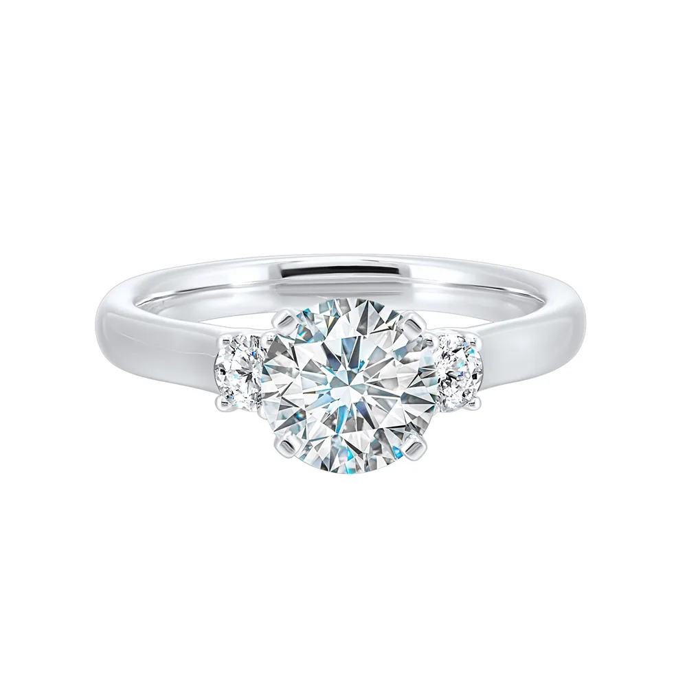 Classic and romantic, this three stone engagement ring features the bold gold shank to sparkle your moments further.