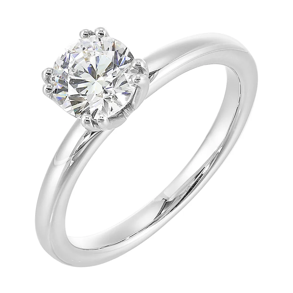 Chic and unique, this double prong setting solitare adds to the sleek, classic look to her style. view 2