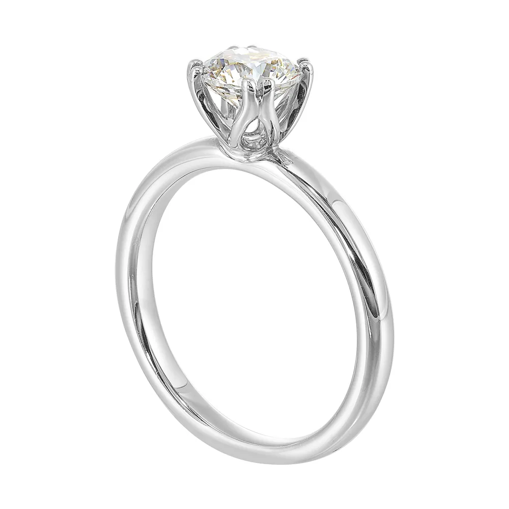 Chic and unique, this double prong setting solitare adds to the sleek, classic look to her style. view 3