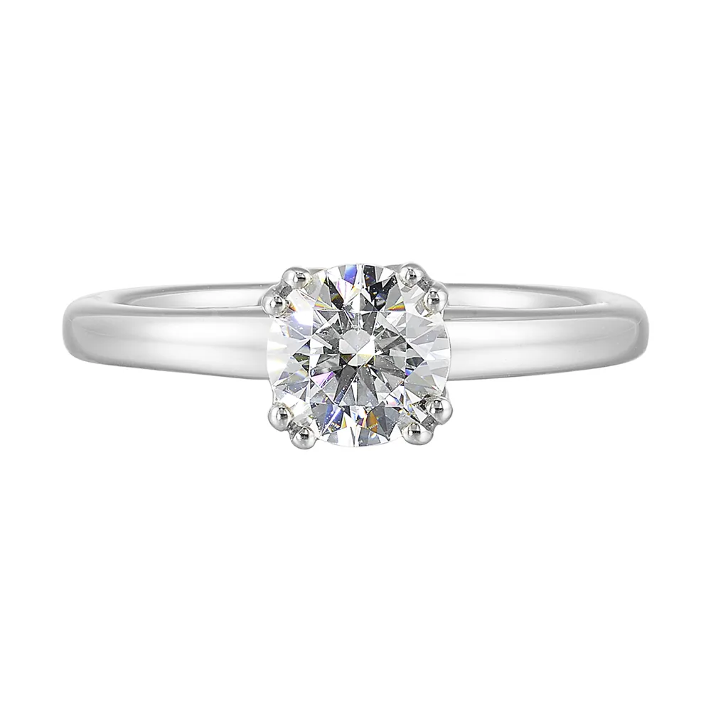 Chic and unique, this double prong setting solitare adds to the sleek, classic look to her style.