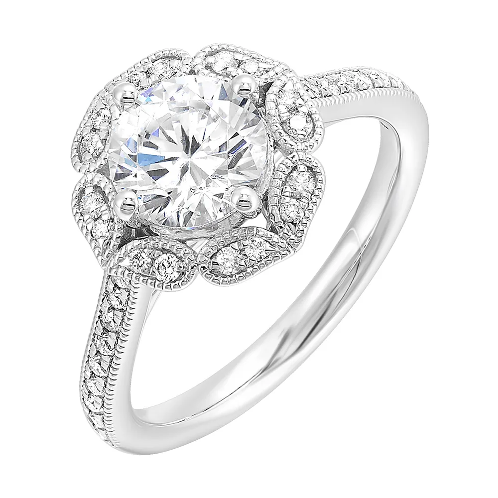 The solitaire ring gets a upgrade with a floral halo and diamond studded shank making your love blossom forever. view 2