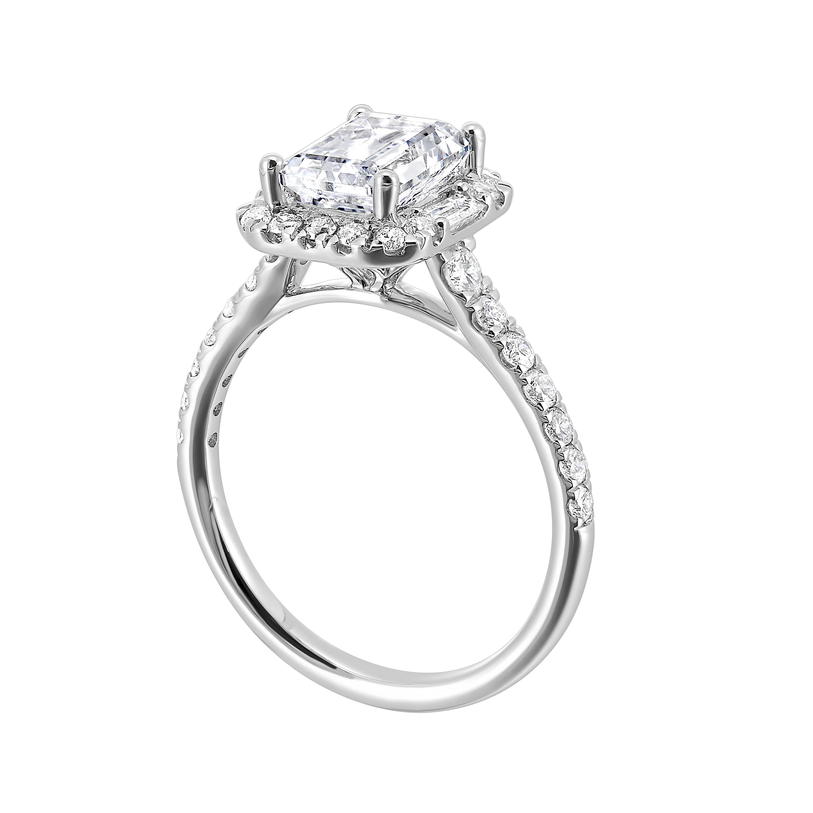 A glittering softened halo of diamonds surrounds the center emerald with adjacent baugettes on both the sides. Pave split shank adds a stylish, dazzling look. view 2